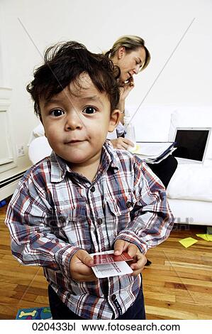portrait of toddler with mother sitting on sofa and talking on mobile phone View Large Photo Image Stock Image - portrait of toddler with mother sitting on sofa and talking on mobile phone. Fotosearch