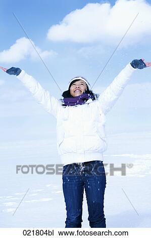 portrait of young asian woman in winter throwing snow into the air View Large Photo Image Stock Image - portrait of young asian woman in winter throwing snow into the air. Fotosearch