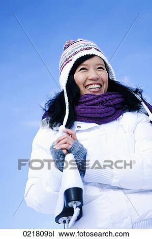 portrait of young asian woman in winter carrying skates View Large Photo Image Stock Image - portrait of young asian woman in winter carrying skates. Fotosearch