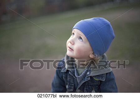 portrait of young boy looking up to the sky View Large Photo Image Stock Image - portrait of young boy looking up to the sky. Fotosearch