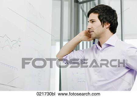 portrait of young businessman in front of whiteboard View Large Photo Image Stock Image - portrait of young businessman in front of whiteboard. Fotosearch