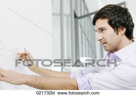 portrait of young businessman in front of whiteboard View Large Photo Image Stock Image - portrait of young businessman in front of whiteboard. Fotosearch
