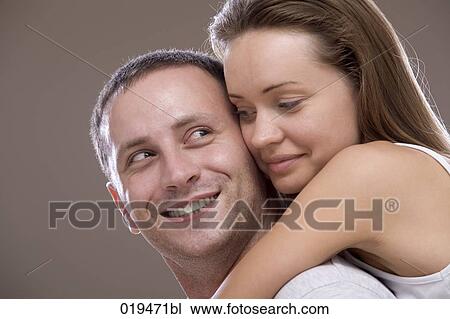 Stock Image - portrait of young couple in tender embrace. Fotosearch