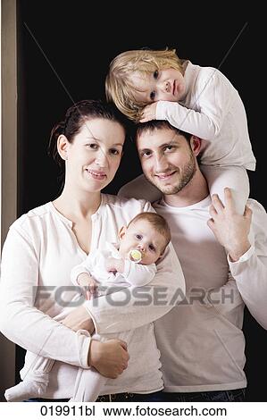 Stock Image - portrait of young family. Fotosearch