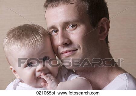 portrait of young father with baby girl View Large Photo Image Stock Image - portrait of young father with baby girl. Fotosearch