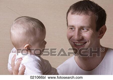 portrait of young father with baby girl View Large Photo Image Stock Image - portrait of young father with baby girl. Fotosearch