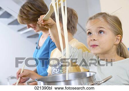 portrait of young girl cooking pasta View Large Photo Image Stock Image - portrait of young girl cooking pasta. Fotosearch