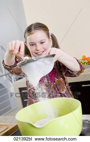 portrait of young girl putting flour through colander View Large Photo Image Stock Image - portrait of young girl putting flour through colander. Fotosearch