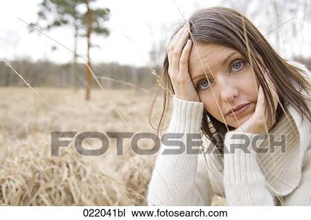 portrait of young woman in autumn sitting in grass View Large Photo Image Stock Image - portrait of young woman in autumn sitting in grass. Fotosearch