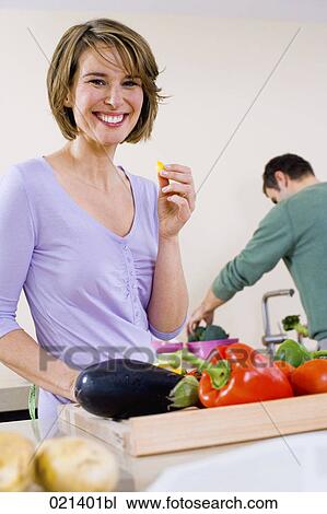 portrait of young woman in kitchen with vegetables View Large Photo Image Stock Image - portrait of young woman in kitchen with vegetables. Fotosearch