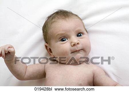 portrait og baby lying on bed View Large Photo Image Stock Image - portrait og baby lying on bed. Fotosearch