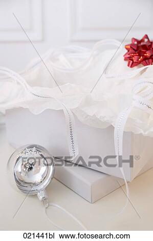 still life of bauble and open present box View Large Photo Image Stock Image - still life of bauble and open present box. Fotosearch