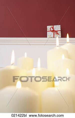still life of burning candles and christmas present View Large Photo Image Stock Image - still life of burning candles and christmas present. Fotosearch
