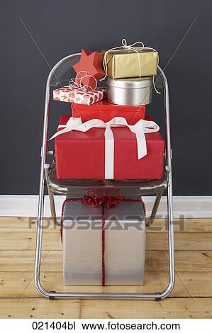 still life of christmas presents on chair View Large Photo Image Stock Image - still life of christmas presents on chair. Fotosearch