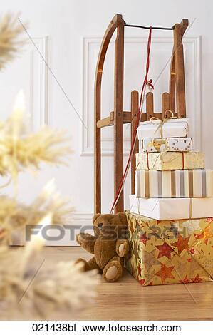 still life of christmas presents teddy bear and sledge View Large Photo Image Stock Image - still life of christmas presents teddy bear and sledge. Fotosearch