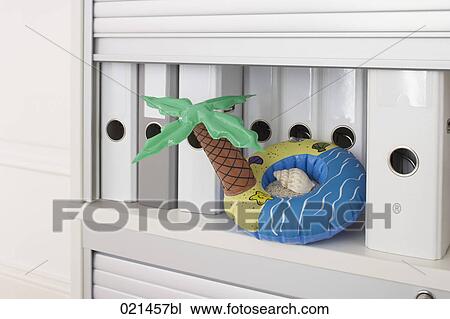 still life of inflatable in form of island in filing cabinet View Large Photo Image Stock Image - still life of inflatable in form of island in filing cabinet. Fotosearch