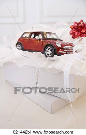 still life of open present box with toy car View Large Photo Image Stock Image - still life of open present box with toy car. Fotosearch