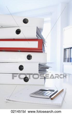 still life of pile of folders with calculator on table View Large Photo Image Stock Image - still life of pile of folders with calculator on table. Fotosearch