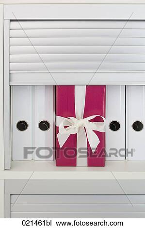 still life of present in filing cabinet View Large Photo Image Stock Image - still life of present in filing cabinet. Fotosearch