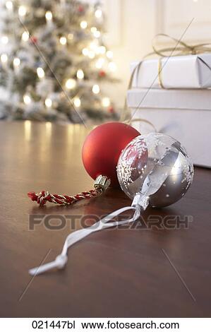 Stock Image - still life of red and silver christmas baubles. Fotosearch