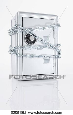 Stock Image - still life of safe protected by chains. Fotosearch
