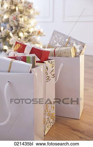 still life of shopping bags with christmas presents View Large Photo Image Stock Image - still life of shopping bags with christmas presents. Fotosearch