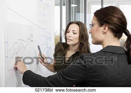two businesswoman in front of whiteboard View Large Photo Image Stock Image - two businesswoman in front of whiteboard. Fotosearch