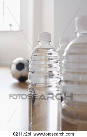 Stock Image - water in plastic bottles on the floor. Fotosearch