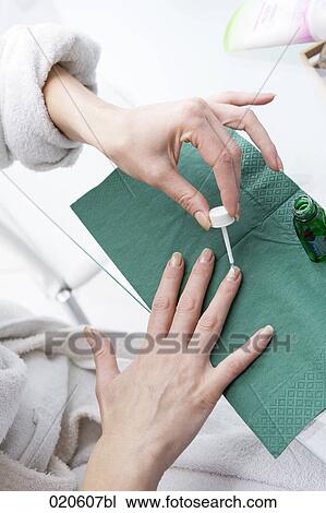 woman applying nail polish View Large Photo Image Stock Image - woman applying nail polish. Fotosearch