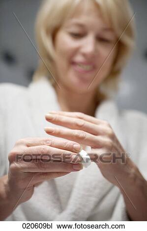 woman cleaning her fingers View Large Photo Image Stock Image - woman cleaning her fingers. Fotosearch