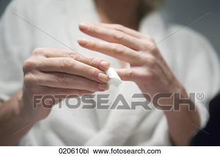 woman cleaning her fingers View Large Photo Image Stock Image - woman cleaning her fingers. Fotosearch