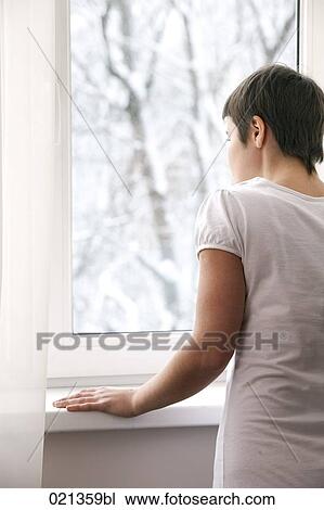 woman looking out of window View Large Photo Image Stock Image - woman looking out of window. Fotosearch