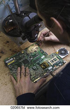 worker repairing motherboard of computer View Large Photo Image Stock Image - worker repairing motherboard of computer. Fotosearch