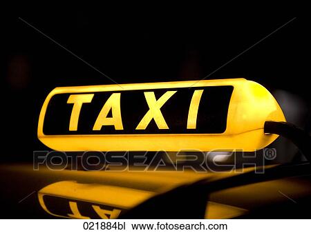 yellow taxi sign at night View Large Photo Image Stock Image - yellow taxi sign at night. Fotosearch