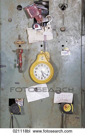 yellow watch hanging on door of cupboard in carpentry View Large Photo Image Stock Image - yellow watch hanging on door of cupboard in carpentry. Fotosearch