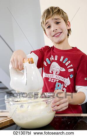 young boy mixing dough in bowl with electric mixer View Large Photo Image Stock Image - young boy mixing dough in bowl with electric mixer. Fotosearch