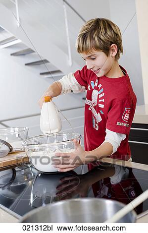 young boy mixing dough in bowl with electric mixer View Large Photo Image Stock Image - young boy mixing dough in bowl with electric mixer. Fotosearch