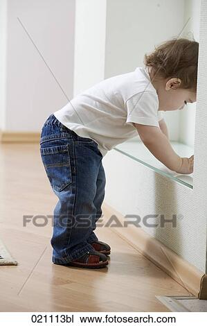 young boy starting to walk at home View Large Photo Image Stock Image - young boy starting to walk at home. Fotosearch