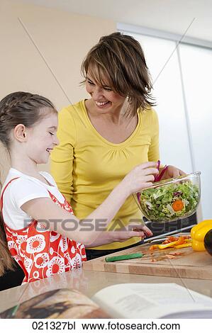 young girl and mother making salad View Large Photo Image Stock Image - young girl and mother making salad. Fotosearch