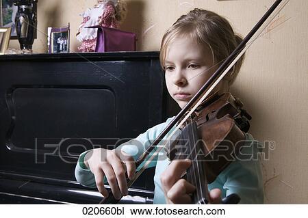 young girl playing violin at home View Large Photo Image Stock Image - young girl playing violin at home. Fotosearch