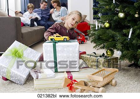 young girl playing with toy car on christmas morning View Large Photo Image Stock Image - young girl playing with toy car on christmas morning. Fotosearch