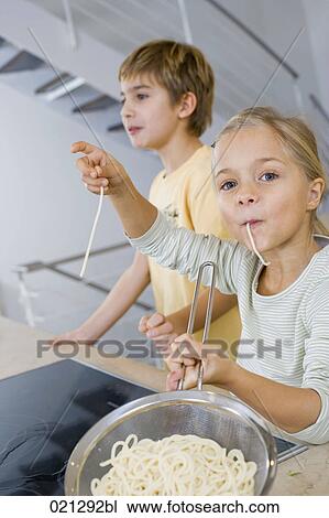 young girl tasting spaghetti View Large Photo Image Stock Image - young girl tasting spaghetti. Fotosearch