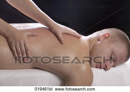 young man getting massage treatment View Large Photo Image Stock Image - young man getting massage treatment. Fotosearch
