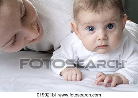young mother playing with her baby girl daughter View Large Photo Image Stock Image - young mother playing with her baby girl daughter. Fotosearch