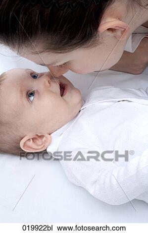 young mother playing with her baby girl daughter View Large Photo Image Stock Image - young mother playing with her baby girl daughter. Fotosearch