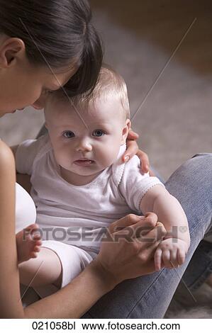 Stock Image - young mother with her baby. Fotosearch