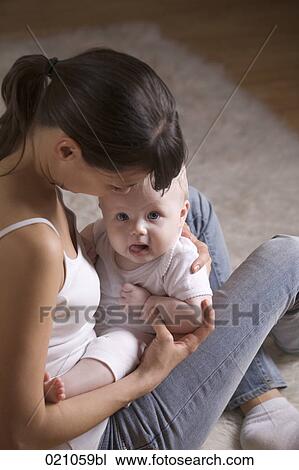 young mother with her baby View Large Photo Image Stock Image - young mother with her baby. Fotosearch