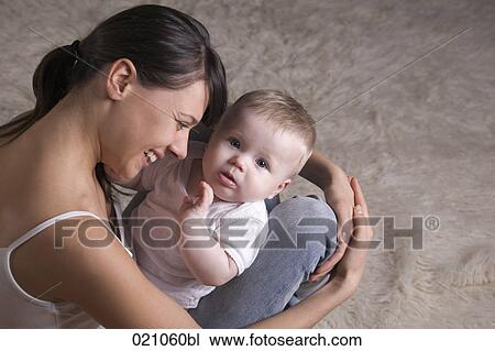 young mother with her baby View Large Photo Image Stock Image - young mother with her baby. Fotosearch