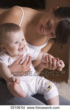 young mother with her baby View Large Photo Image Stock Image - young mother with her baby. Fotosearch