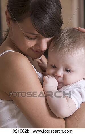 Stock Image - young mother with her baby. Fotosearch